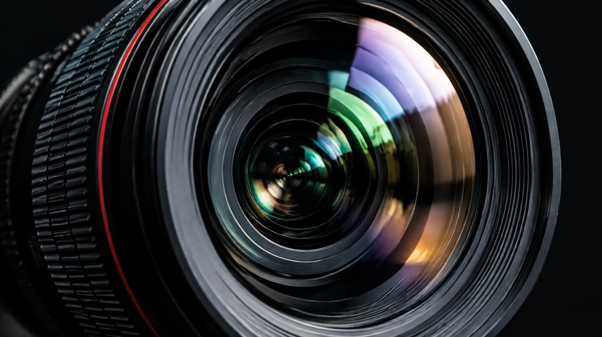 Close-up of a camera lens with glass reflections